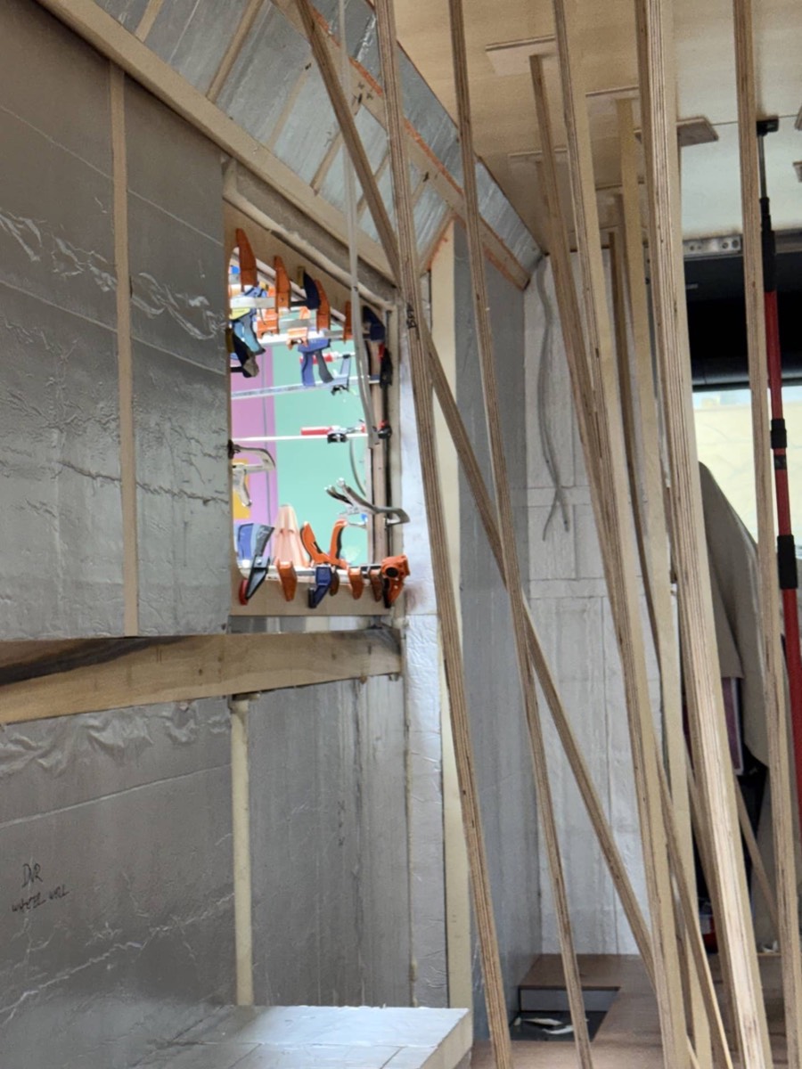 Same window opening seen from inside with timber framing around it